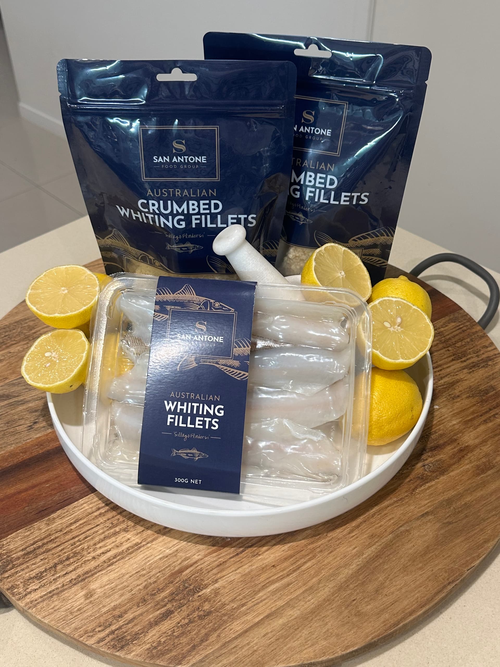 San Antone Australian Whiting Fillets — natural IQF tray pack with crumbed pouch packaging and fresh lemons
