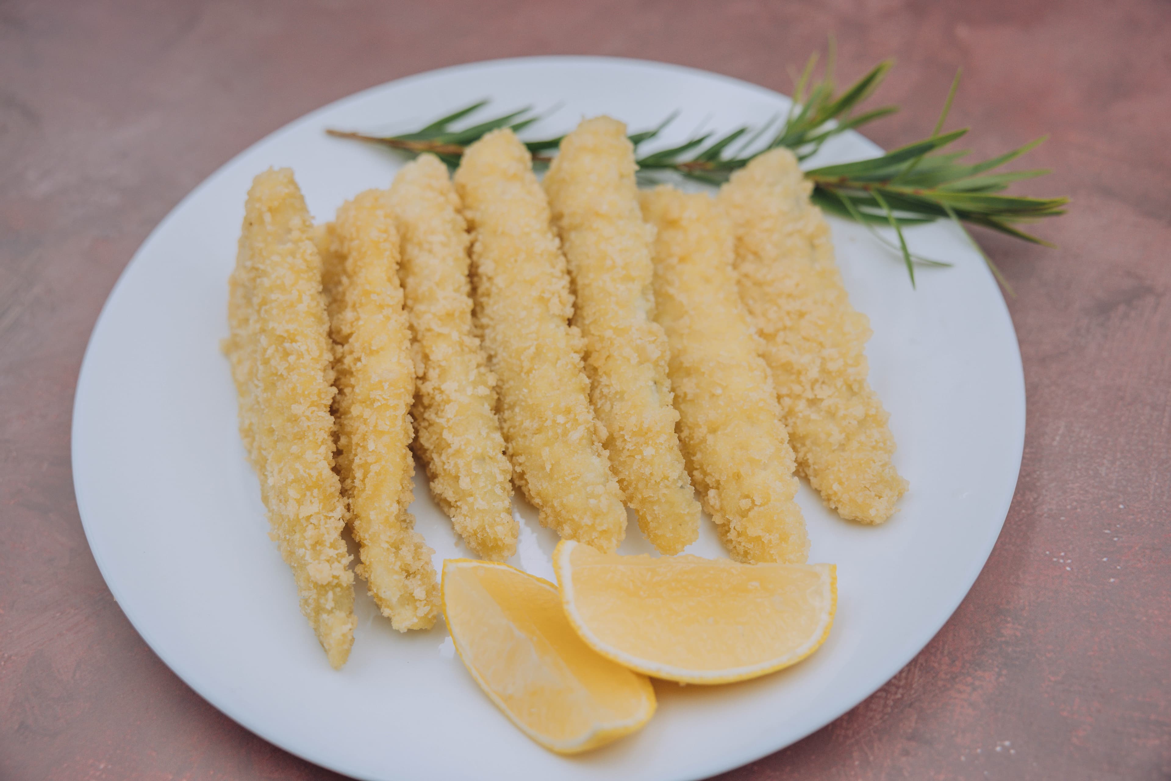 Panko crumbed Eastern School Whiting fillet plated, packaging visible in background