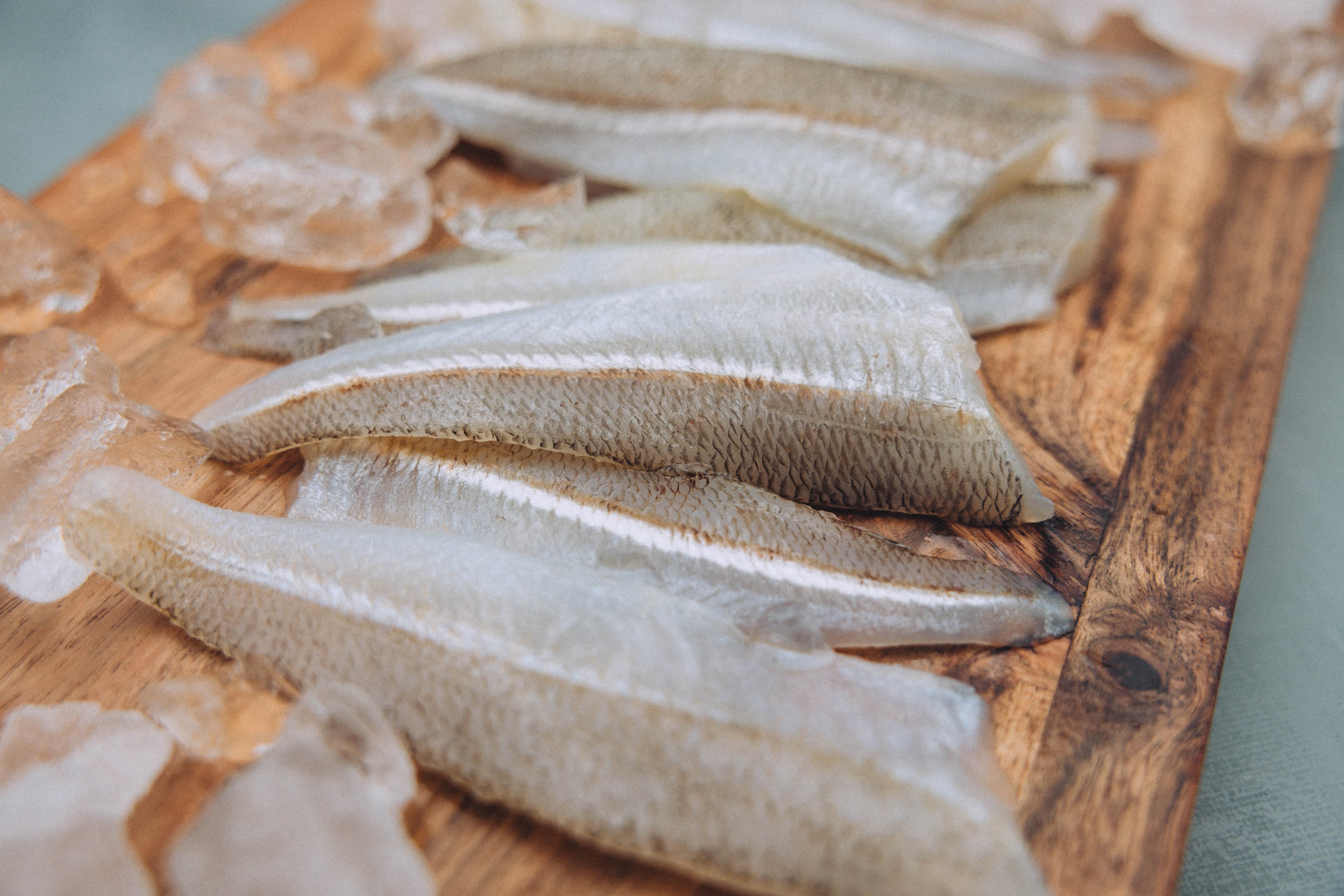 Fresh Eastern School Whiting fillets on chopping board with ice